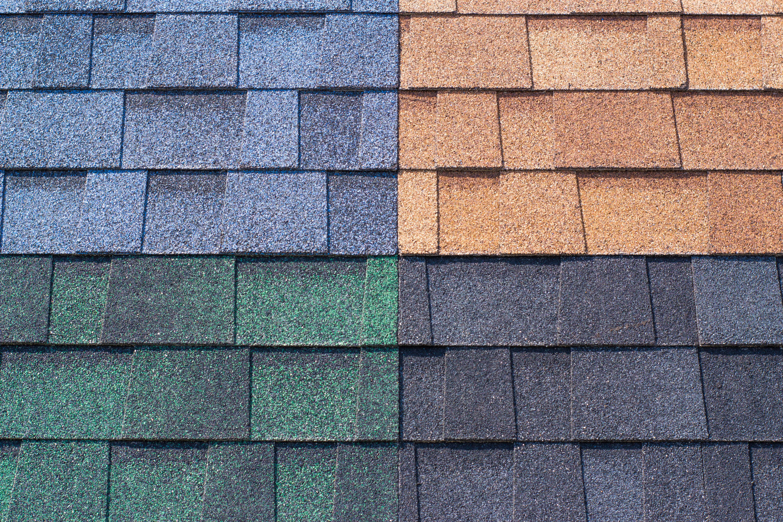 Four different roof shingle colors; brown, blue, grey and green.